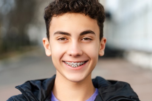 Teenage boy smiling with braces