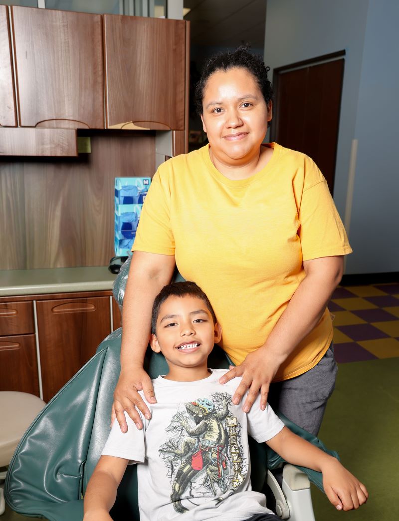 Mother and son in a treatment room at Smile Magic in Grand Prairie