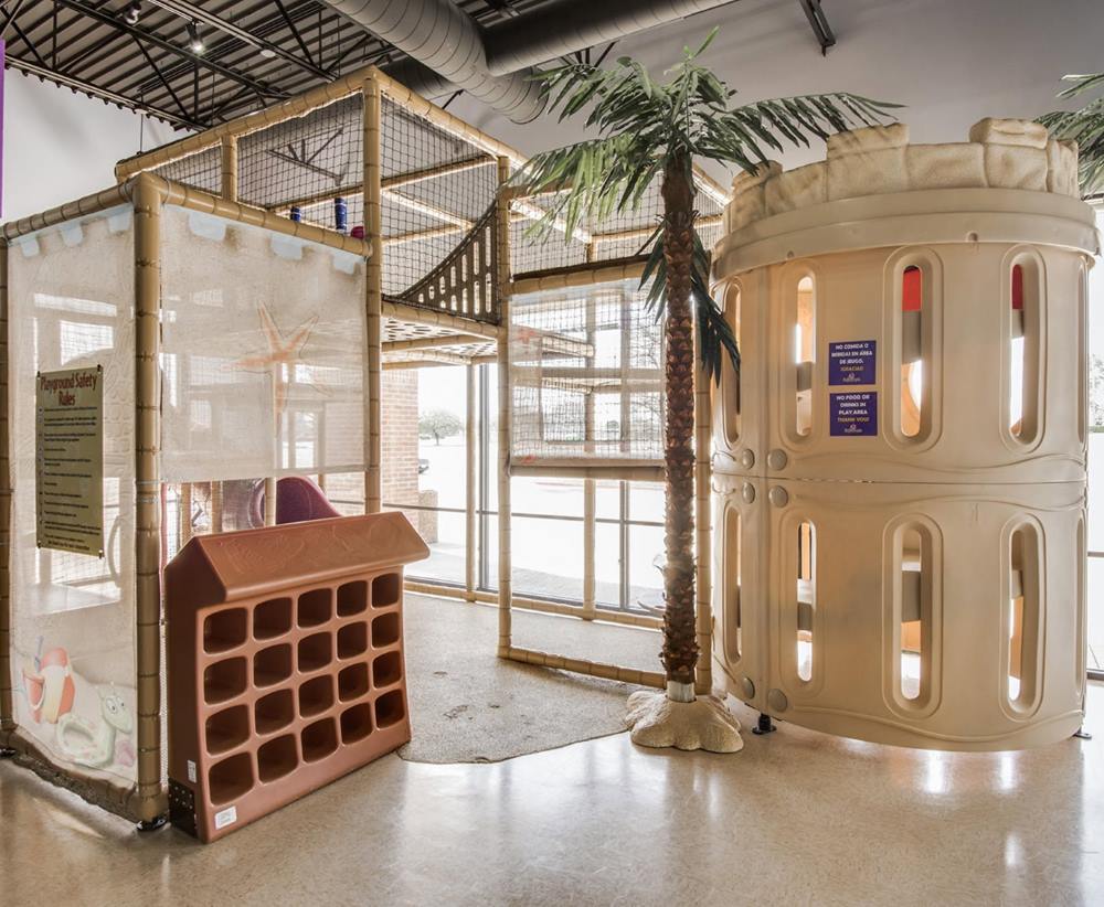 Indoor play area and shoe cubbies at Smile Magic in Lewisville